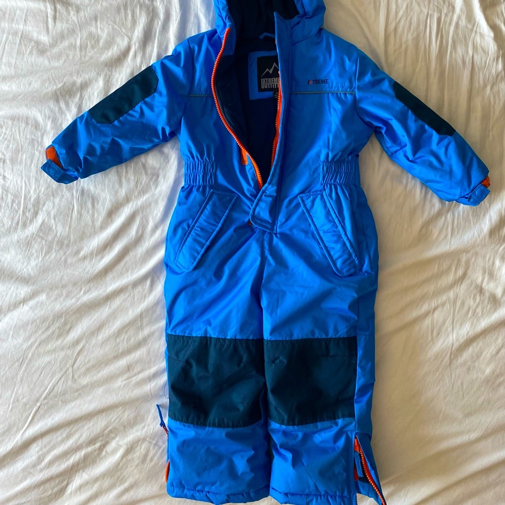 Fully insulated snowsuit for boys with bright orange trim.